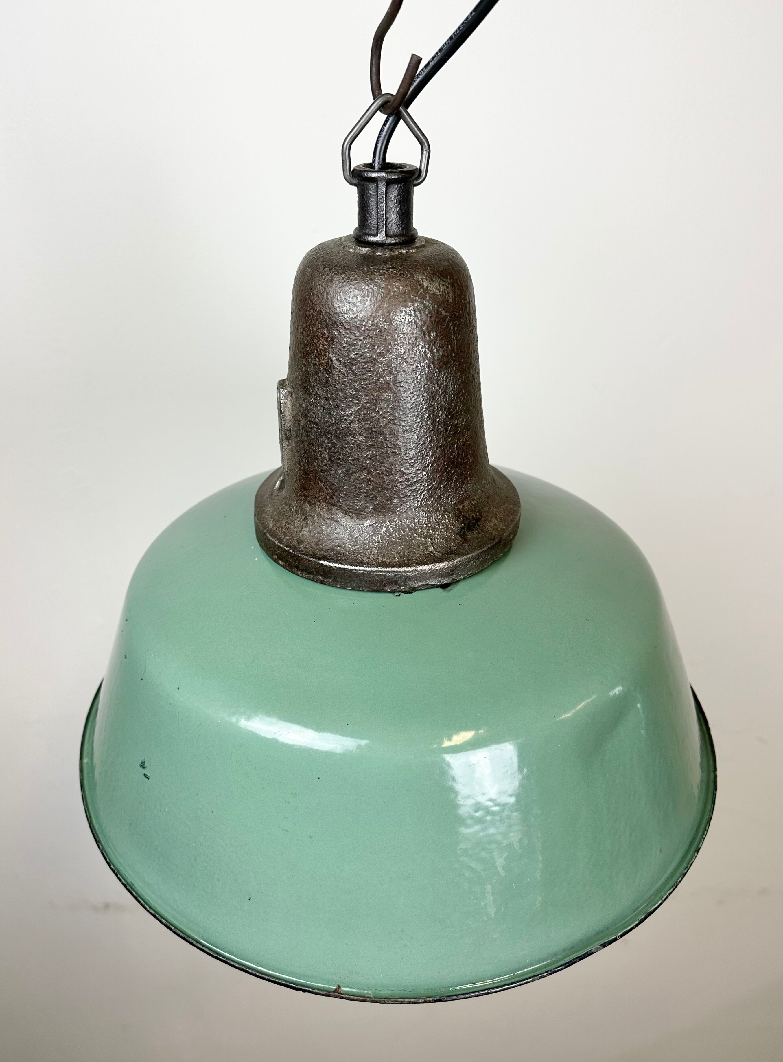 Industrial green enamel factory lamp with cast iron top, 1960s