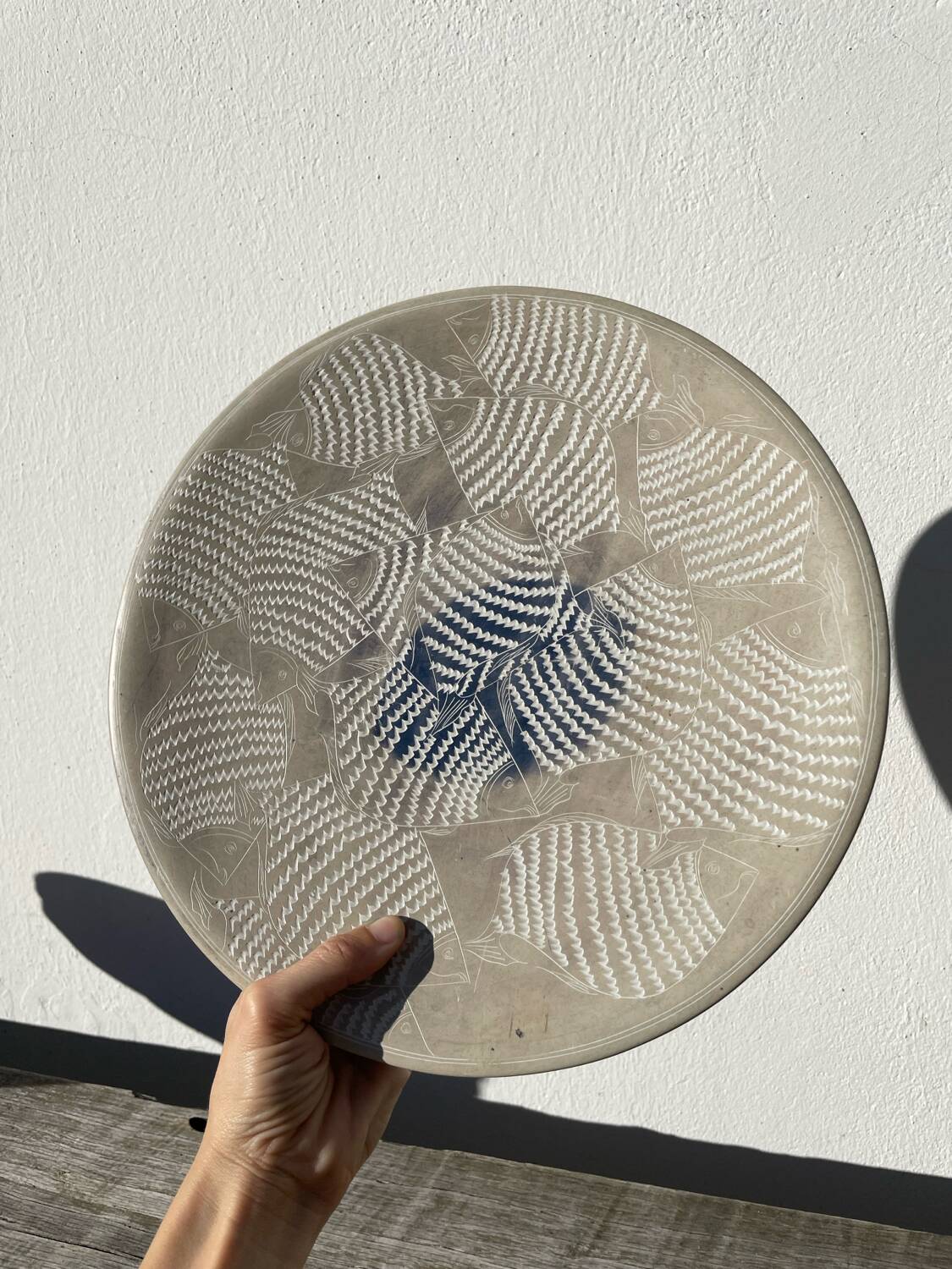 Ethnic handmade round fish dish