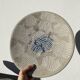 Ethnic handmade round fish dish