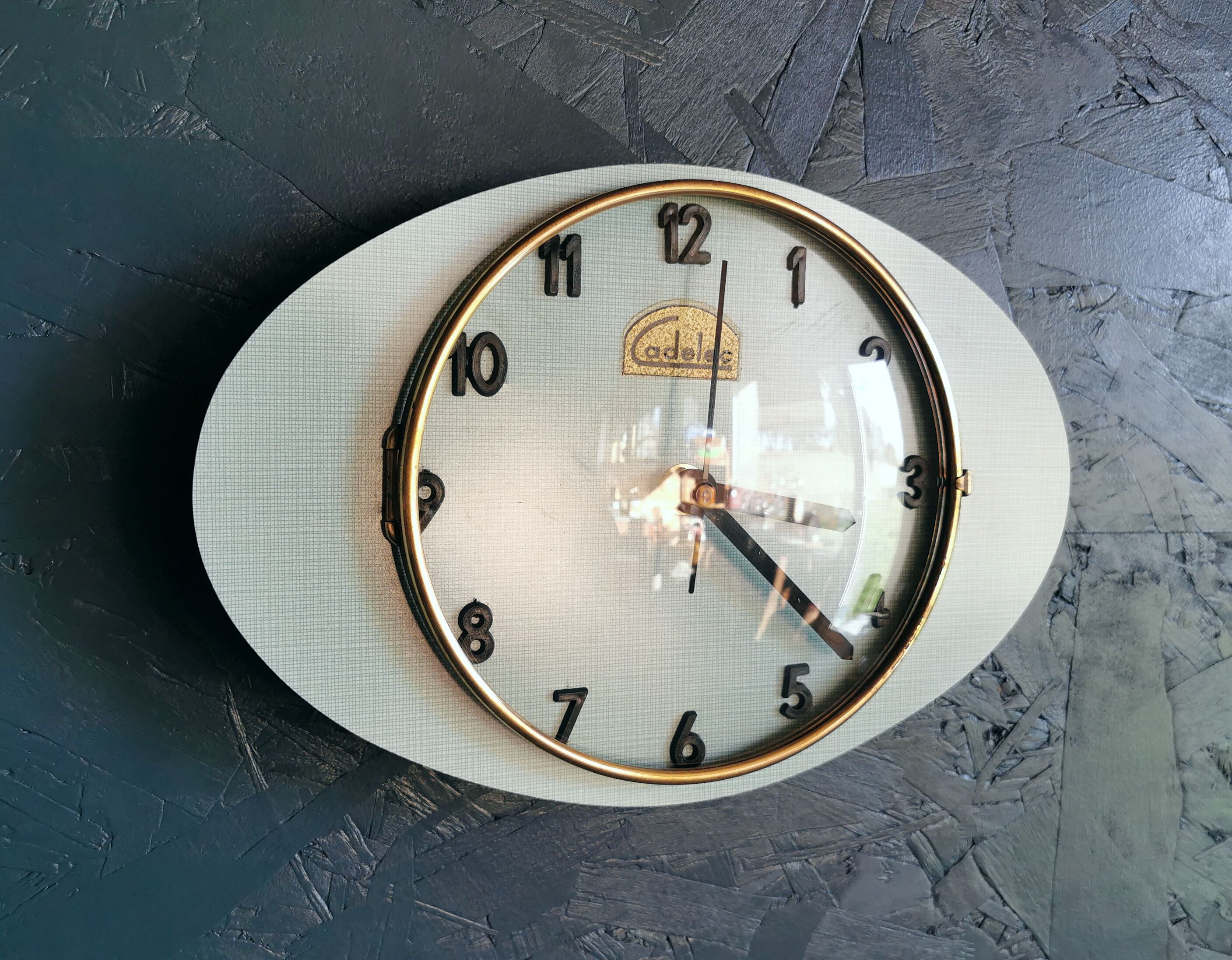 Vintage formica clock oval silent wall clock "Cadelec blue"