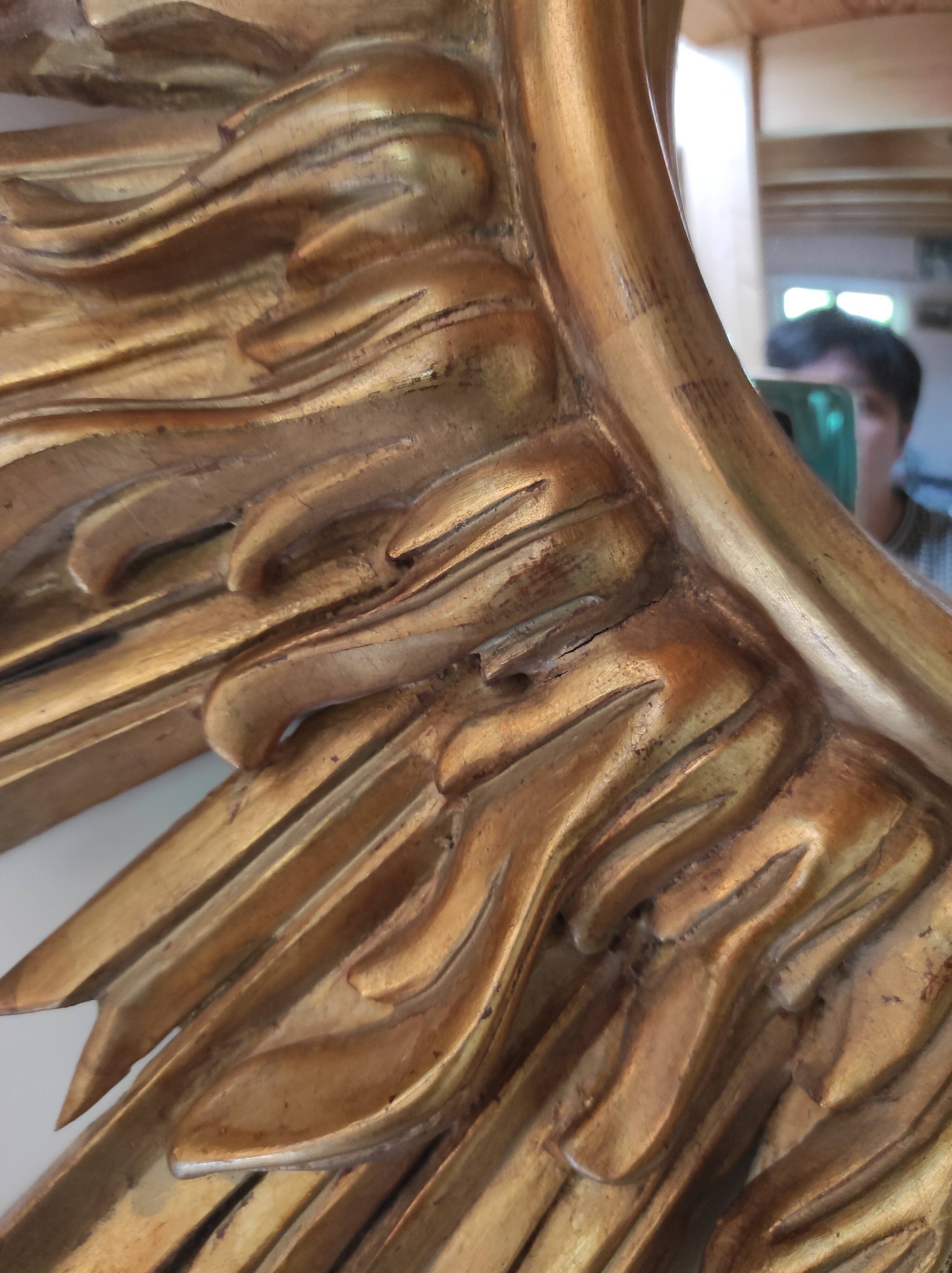 Sun mirror and witch's eye in gilded wood