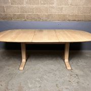 Oval extendable dining table in beech with Danish design.