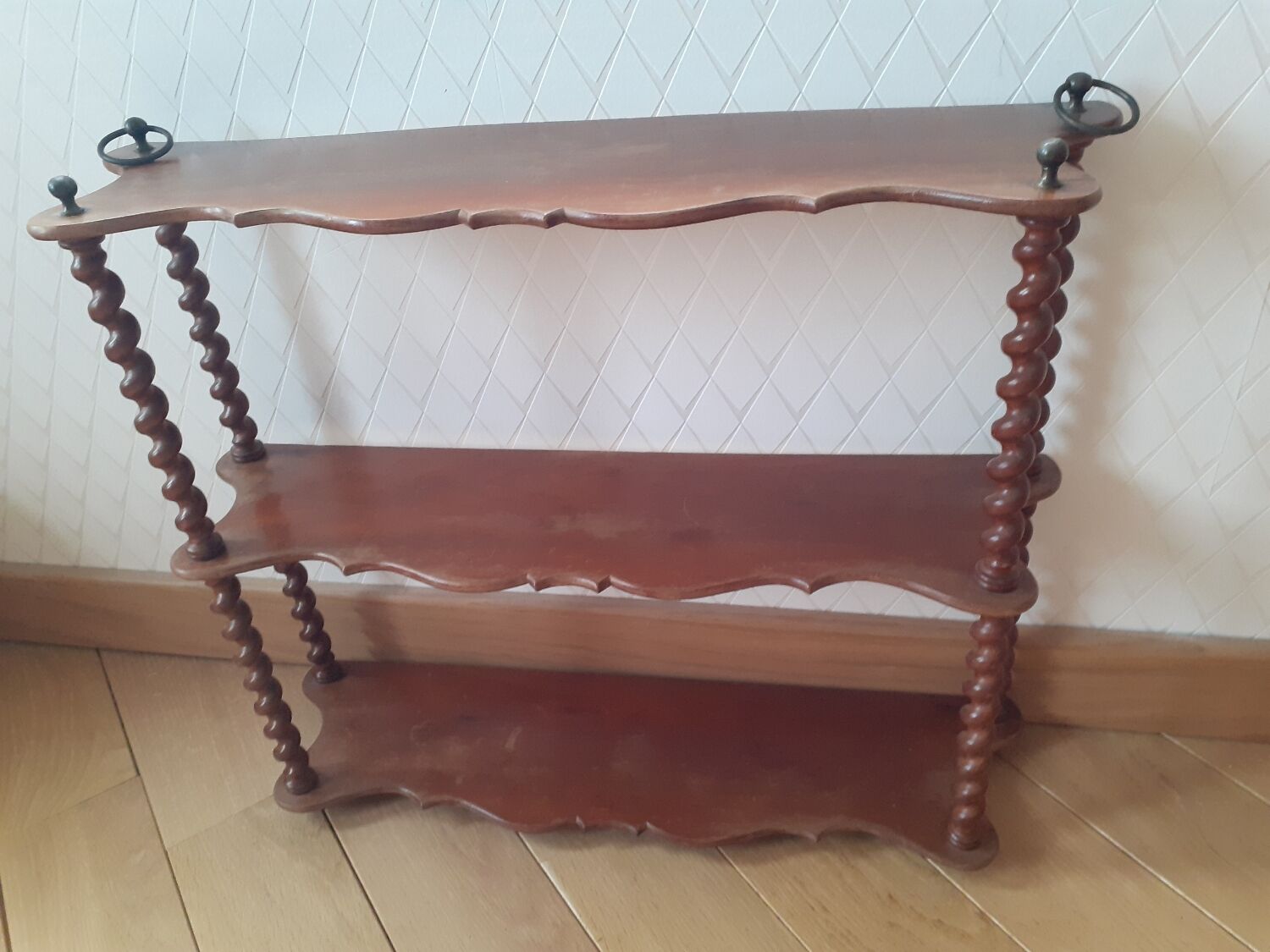 Turned wooden wall shelf