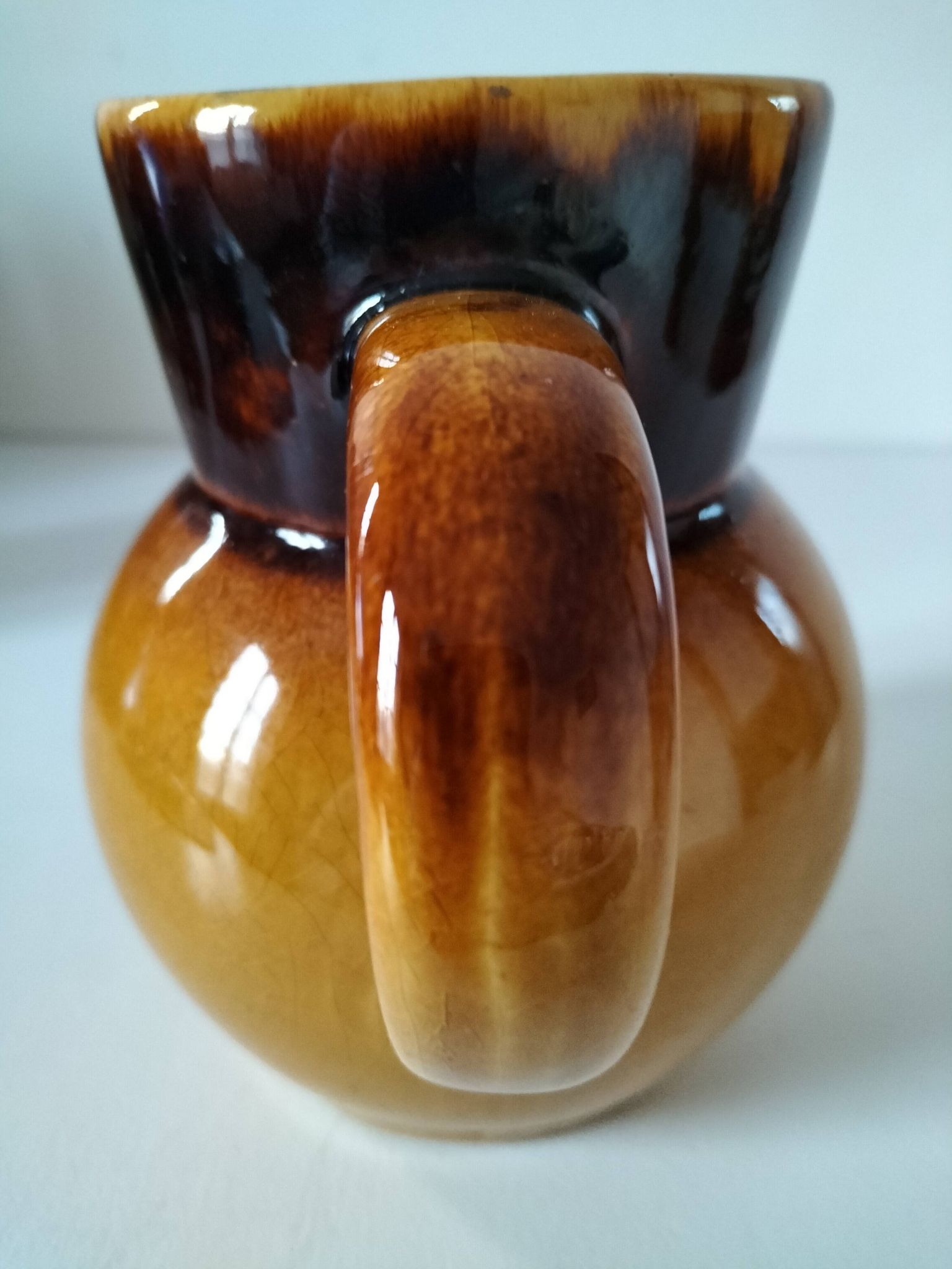 Glazed earthenware jug