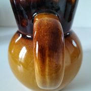 Glazed earthenware jug
