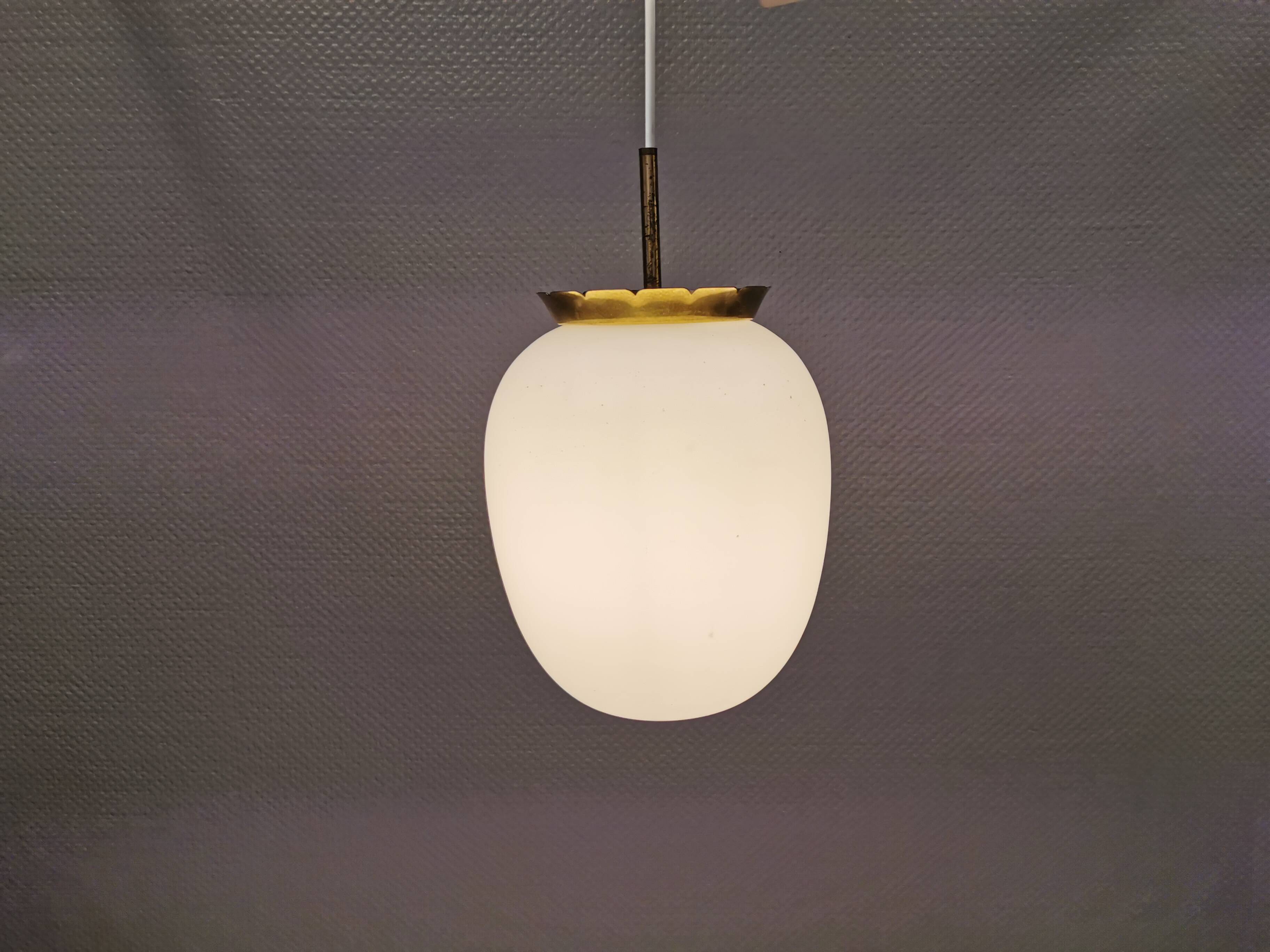 Old hanging lamp in milky white opal glass and brass top/suspension. Danish design 1930s