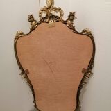 Miroir mural avec ornements dores patine
