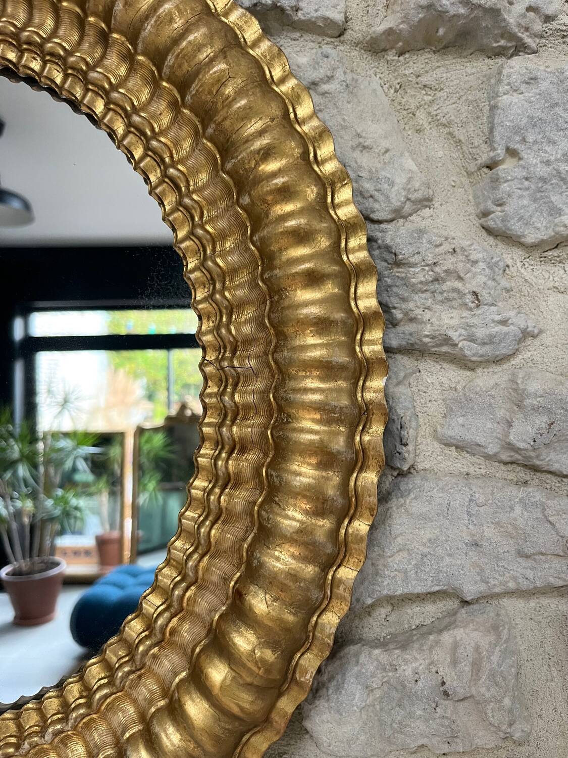 Pair of antique oval mirrors gilded with gold leaf and mercury.