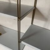 Vintage wall shelves in gold metal