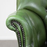 Large green cowhide Chesterfield office chair in English style on wheels