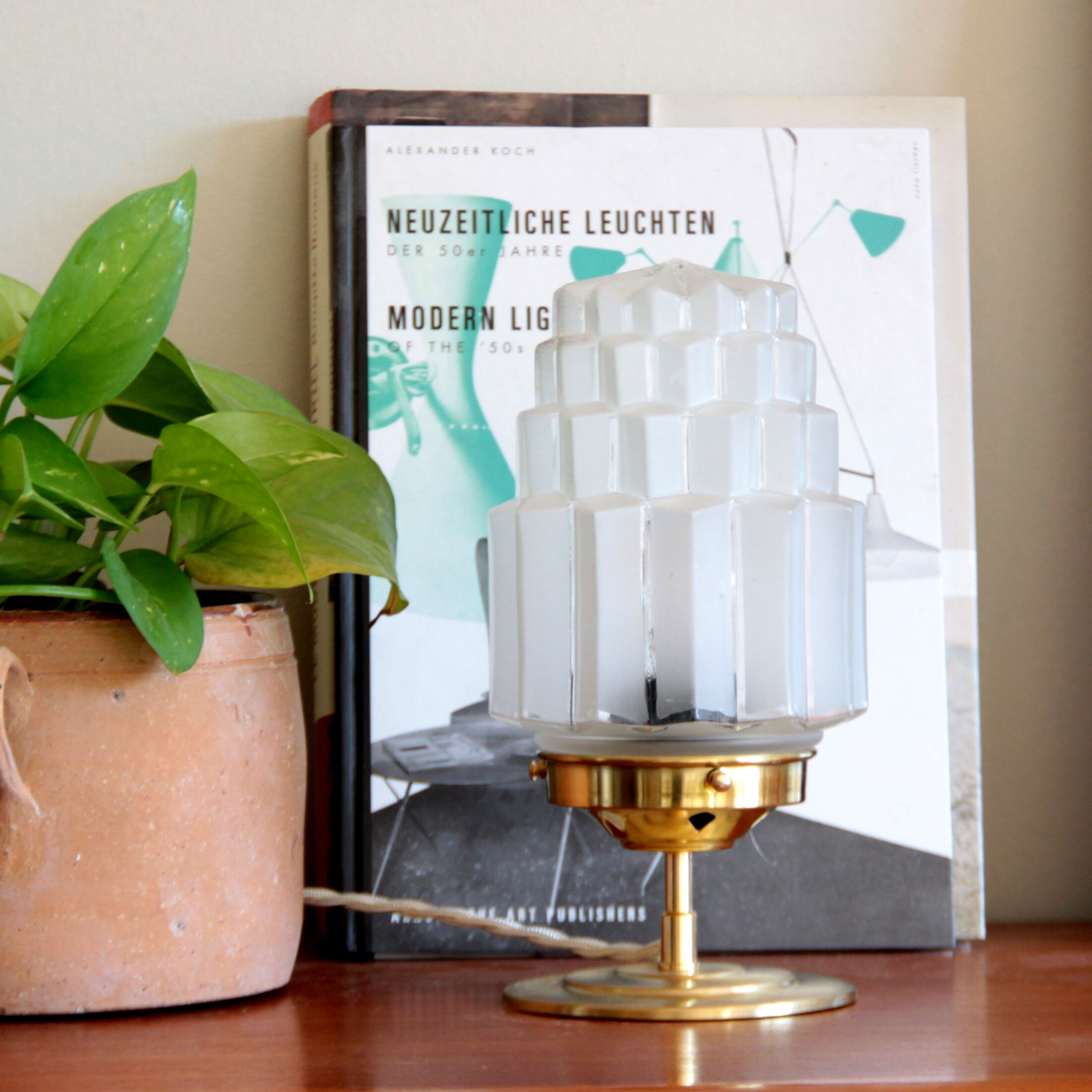 Table lamp in old glass art deco skyscraper and brass vintage bedside lamp