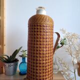 Thermos bottle with wicker canning