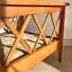 Pair of vintage wooden armchairs with braces