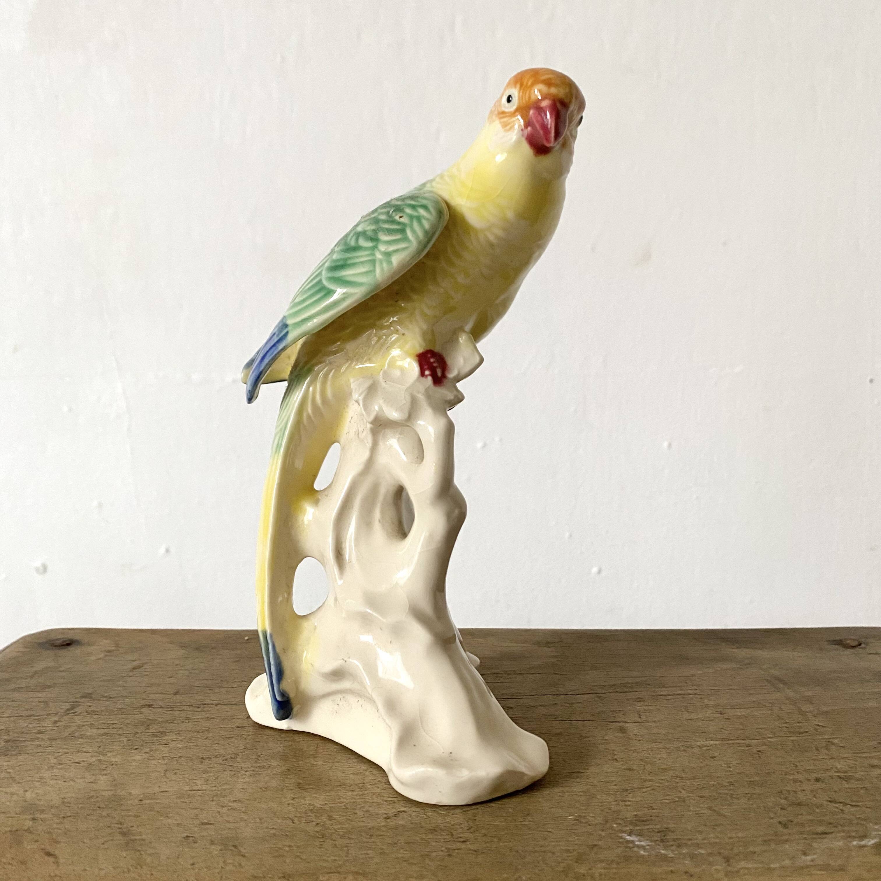 Ceramic parakeet, exotic bird in slip