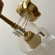 Pair of gold steel wall lamps, plexi and pleated plastic shades 60s-70s
