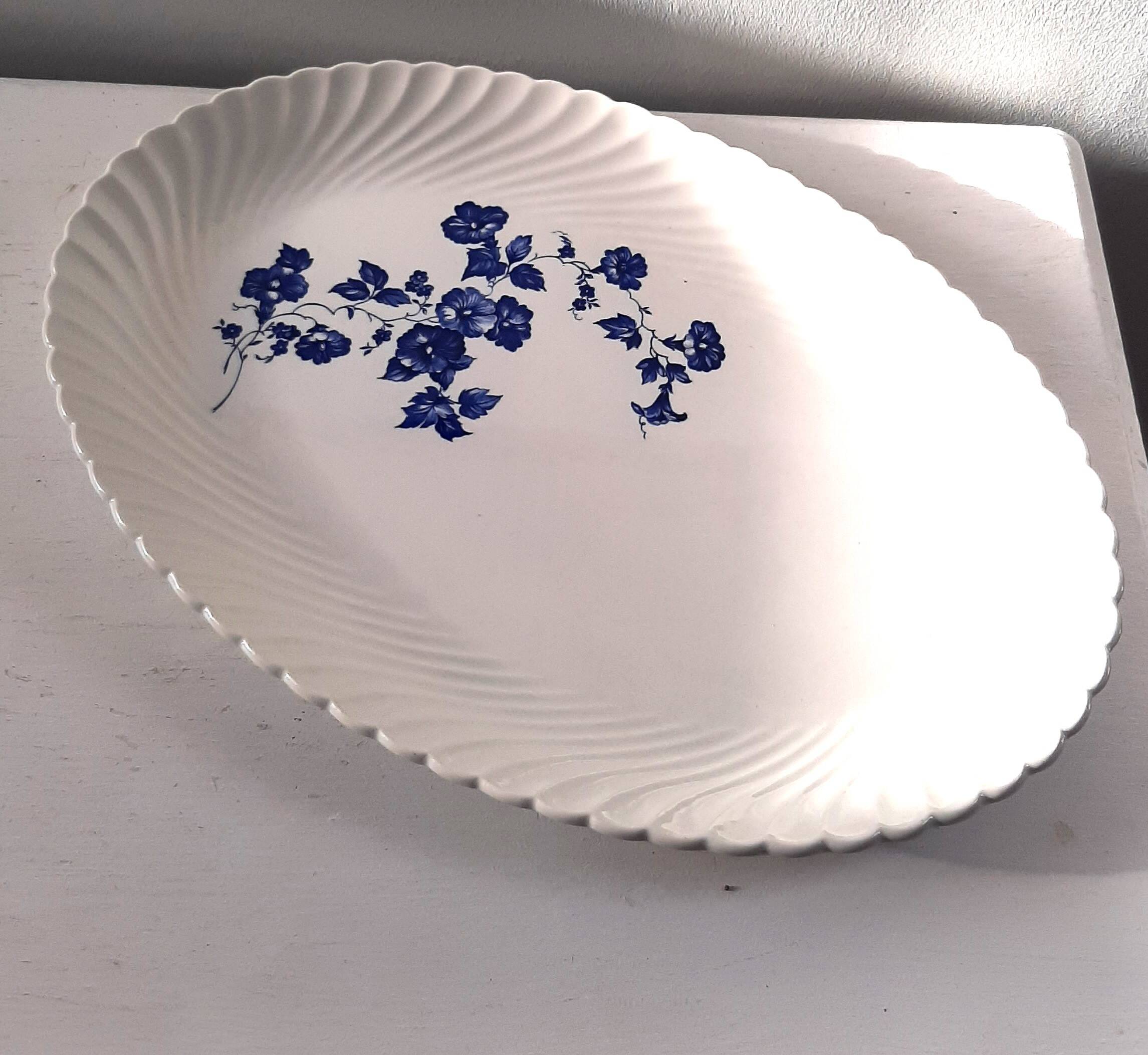 Keller and Guérin Lunéville serving dish with blue flowers on a white background.