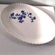 Keller and Guérin Lunéville serving dish with blue flowers on a white background.