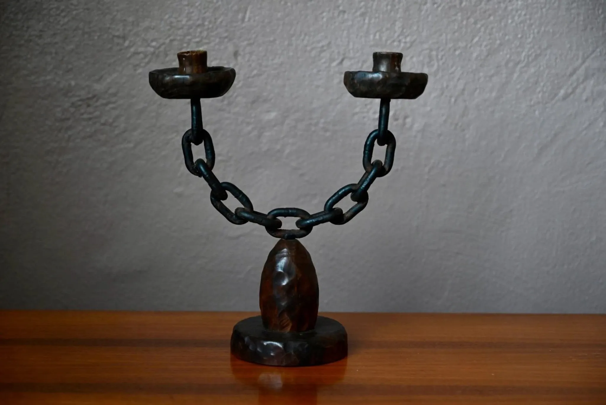 Sculpted wooden and wrought iron brutalist double chandelier from the 1960s.