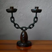 Sculpted wooden and wrought iron brutalist double chandelier from the 1960s.