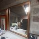 Old mirror of period handmade by cabinetmaking and decorated with gold leaf