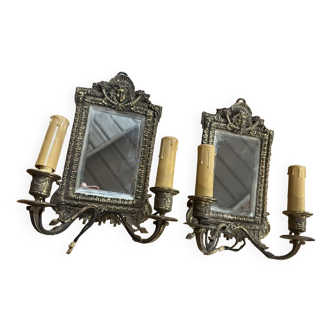 Pair of bronze wall lights decorated with a mirror