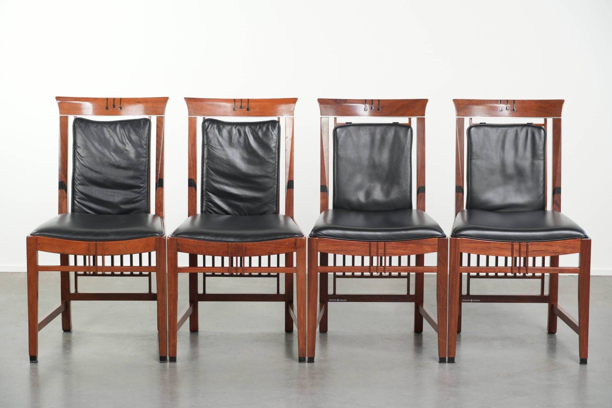 Elegant set of four black cowhide and wooden Art Deco dining chairs