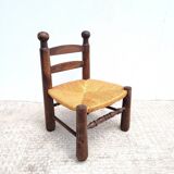 Low chair in turned wood and straw