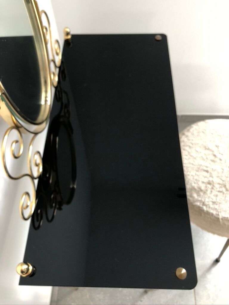 Brass hairdresser, glass and black plastic with its fluffy stool.