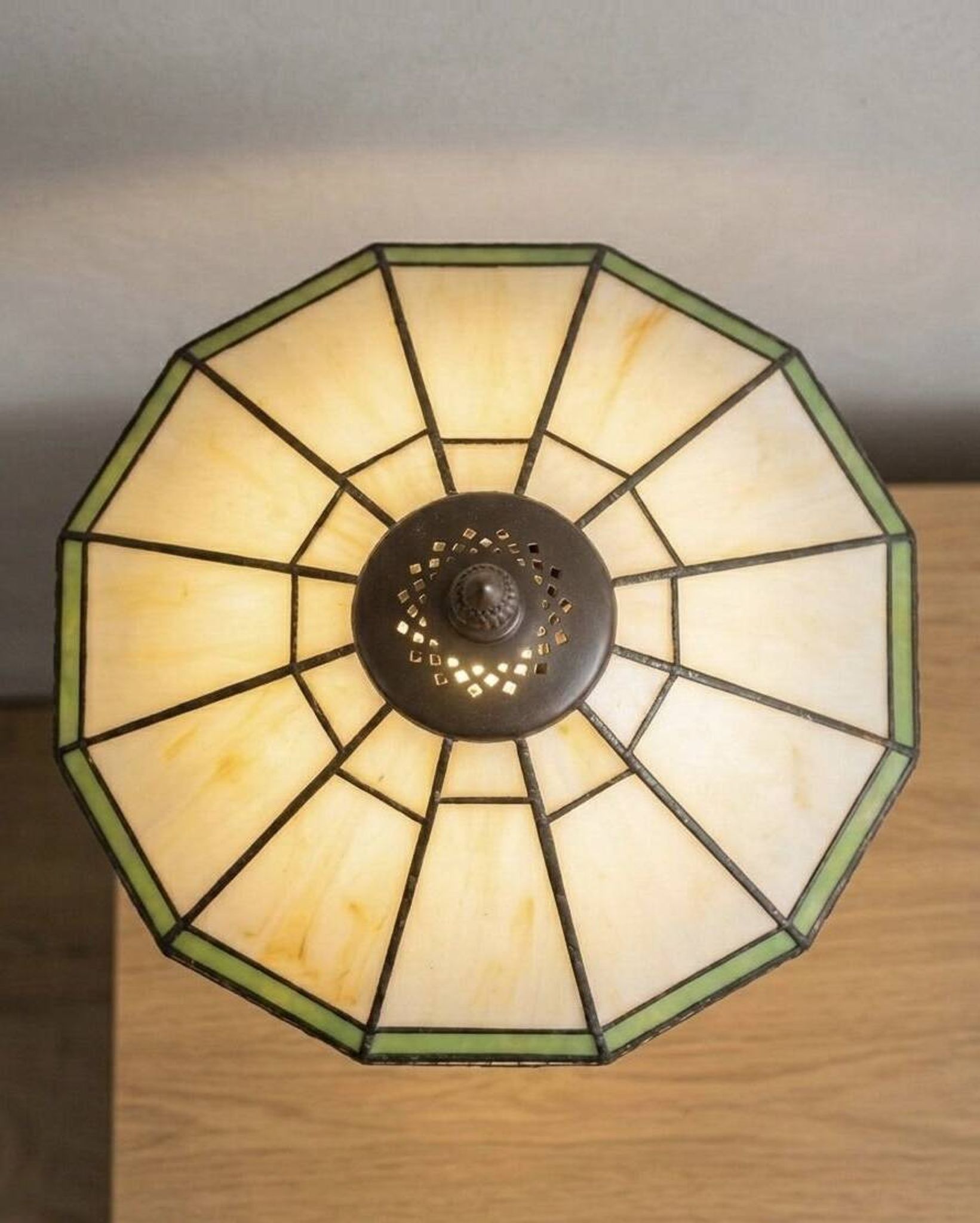 Tiffany-style stained glass lamp in green and amber white with vintage inspiration.