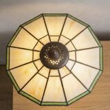 Tiffany-style stained glass lamp in green and amber white with vintage inspiration.