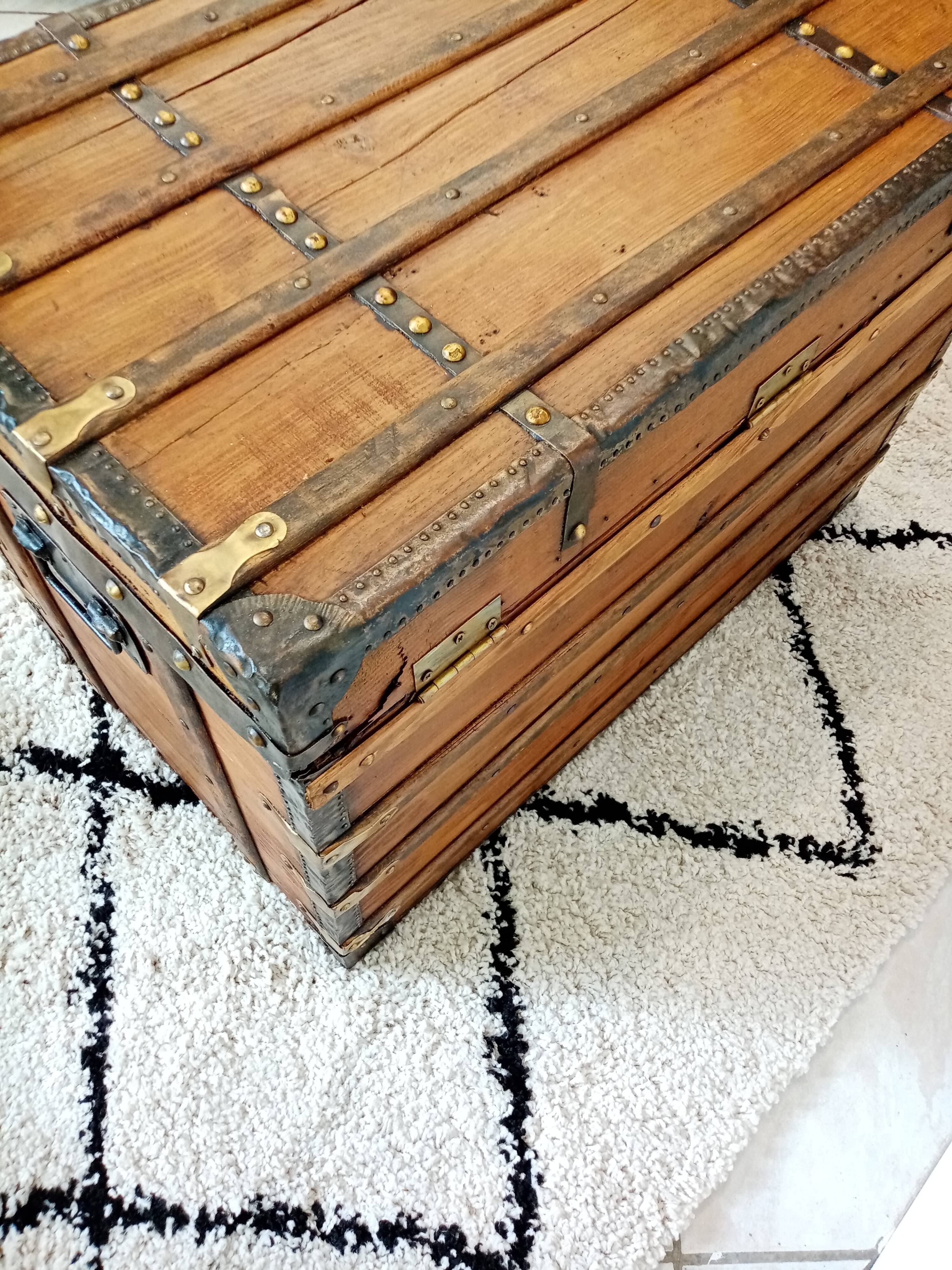 Restored varnished wooden antique travel trunk