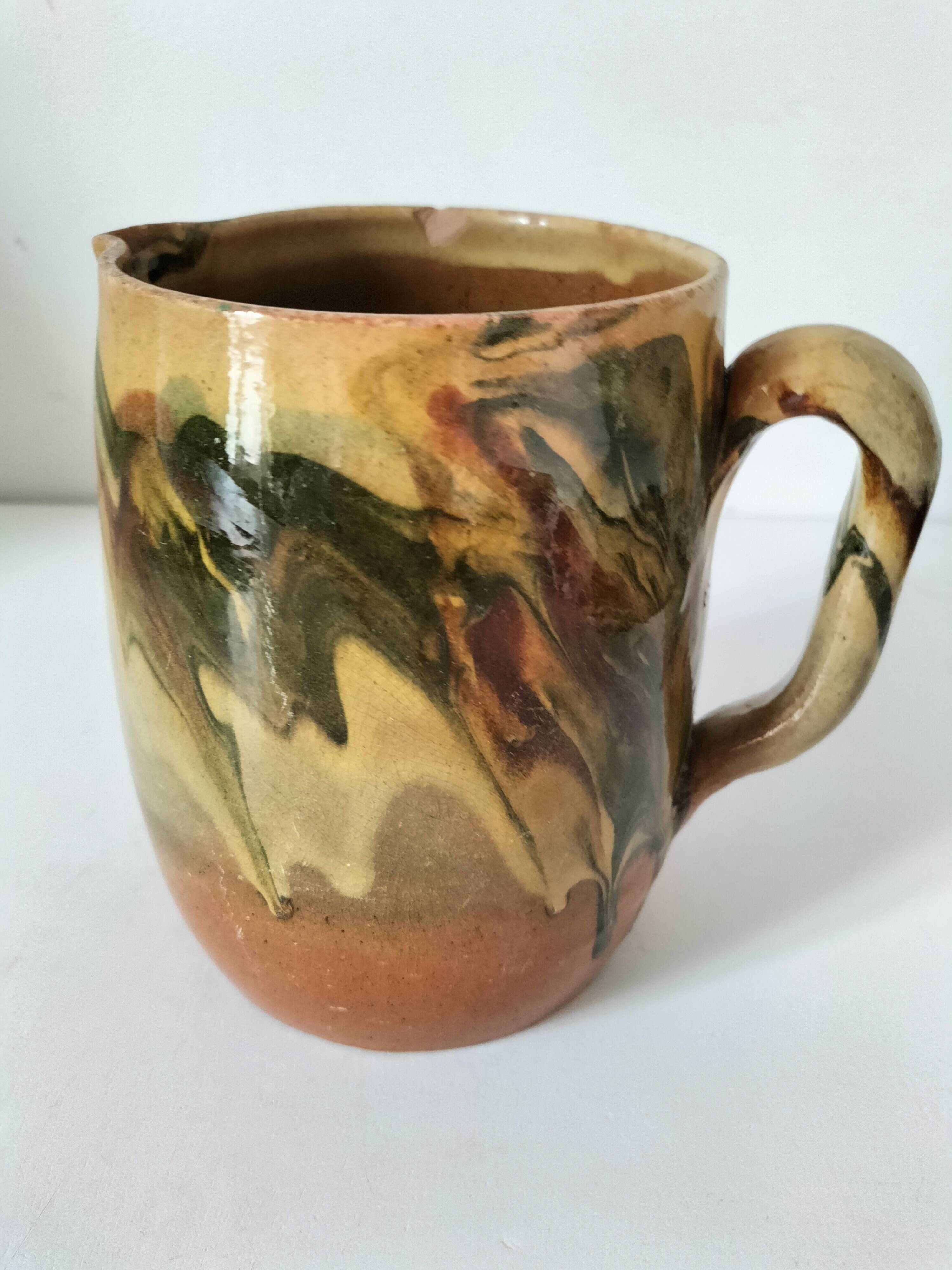 Glazed earthenware jug