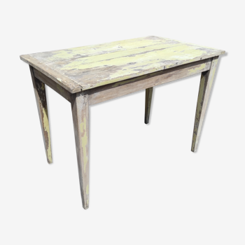 Old table in yellow patinated beech wood