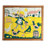 Wooden frame puzzle from the 1940s/50s depicting a farmer's wife.