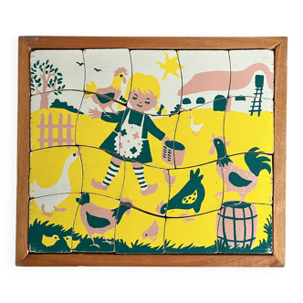 Wooden frame puzzle from the 1940s/50s depicting a farmer's wife.