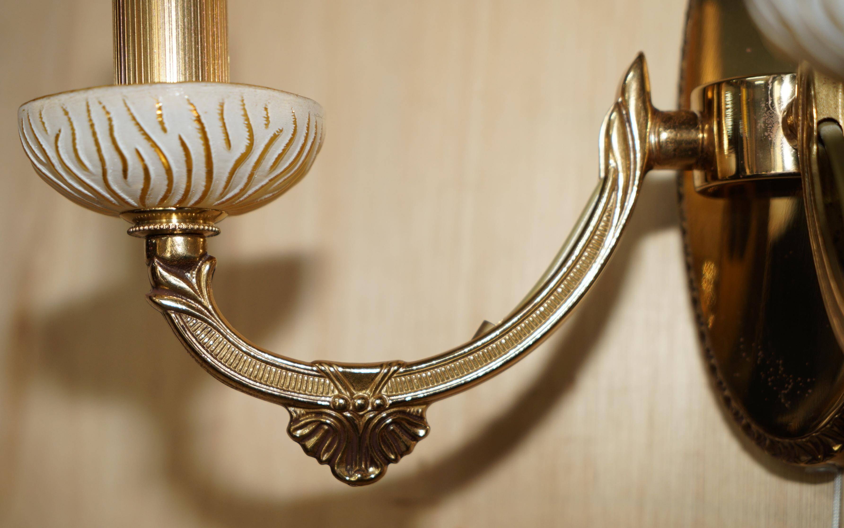 Reccagni wall light pair in brass and frosted glass.