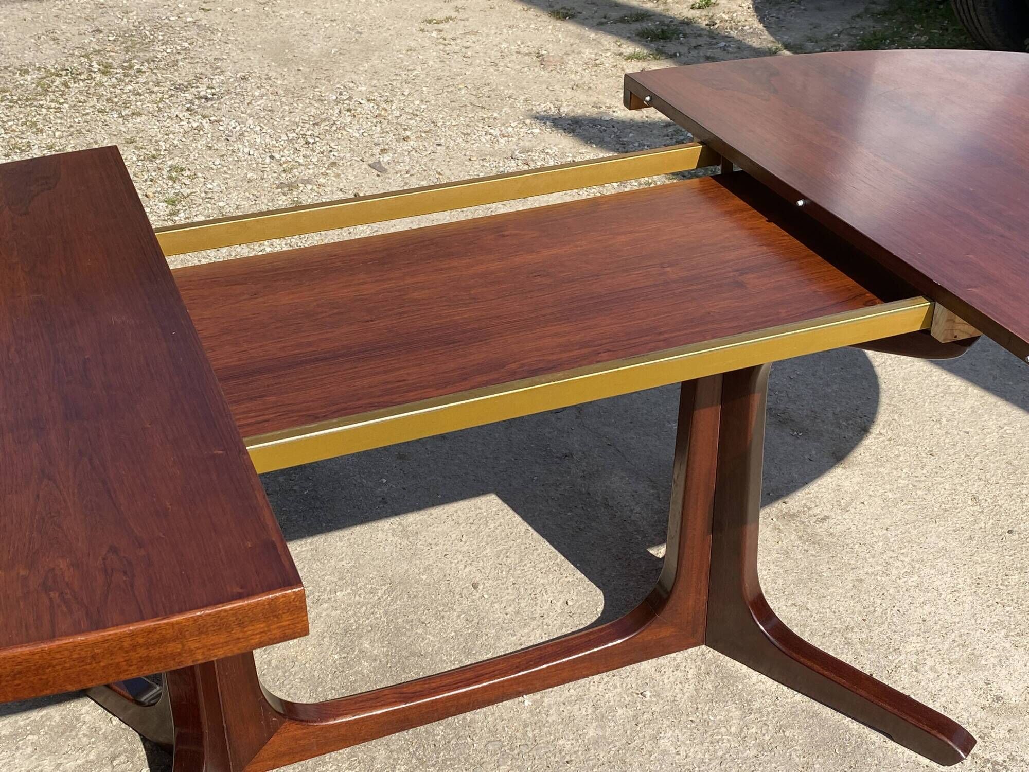 Baumann round oval extendable Scandinavian table in rosewood with 2 extensions.