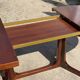 Baumann round oval extendable Scandinavian table in rosewood with 2 extensions.