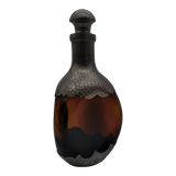 Vintage decanter in glass and tin.