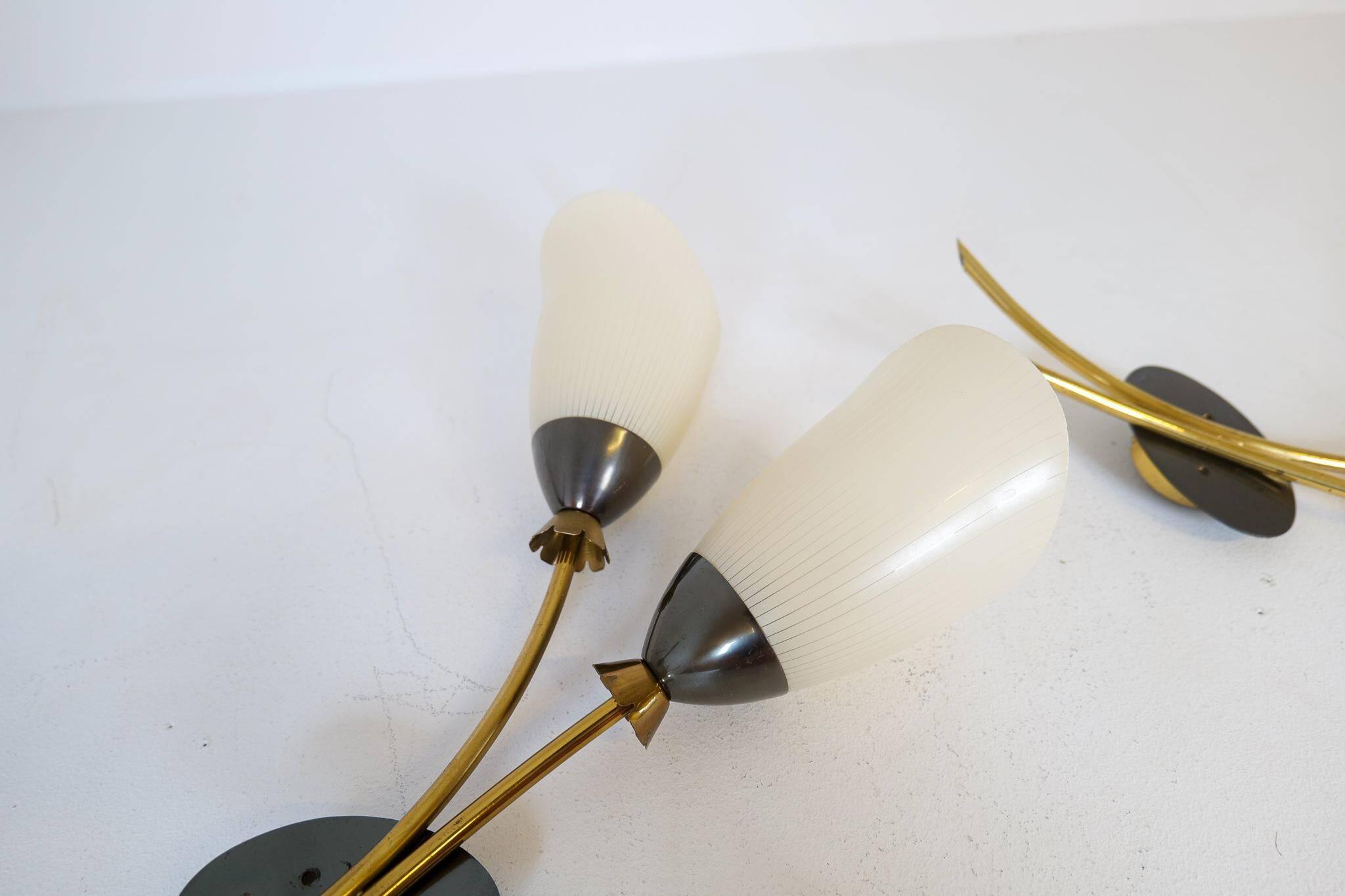 Mid-century pair of wall lamps in brass and opaline attributed to Asea Sweden, 1950s.