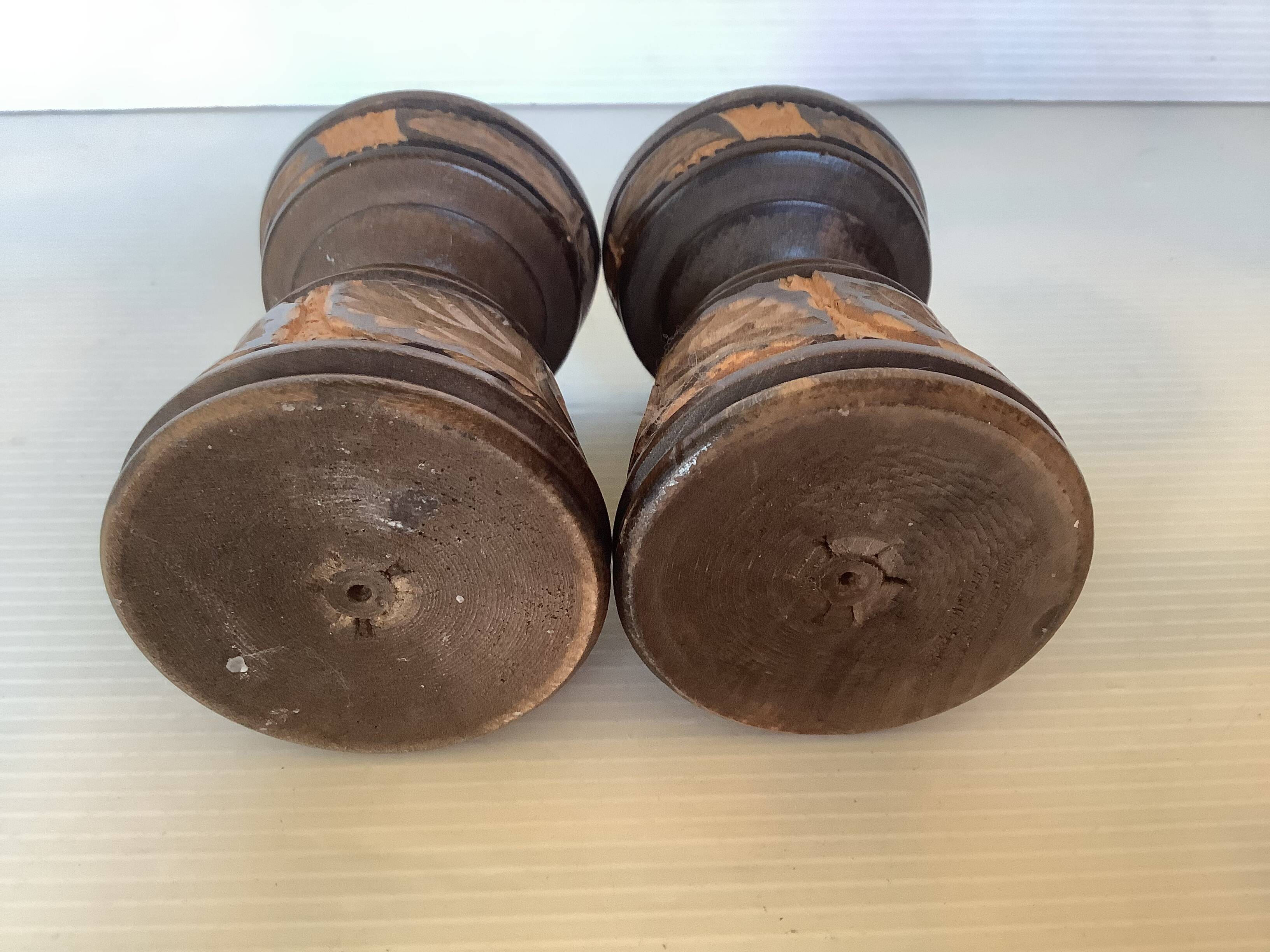 Pair of carved wooden candlesticks