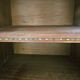 Dark wood sideboard with brass finishes and compass feet