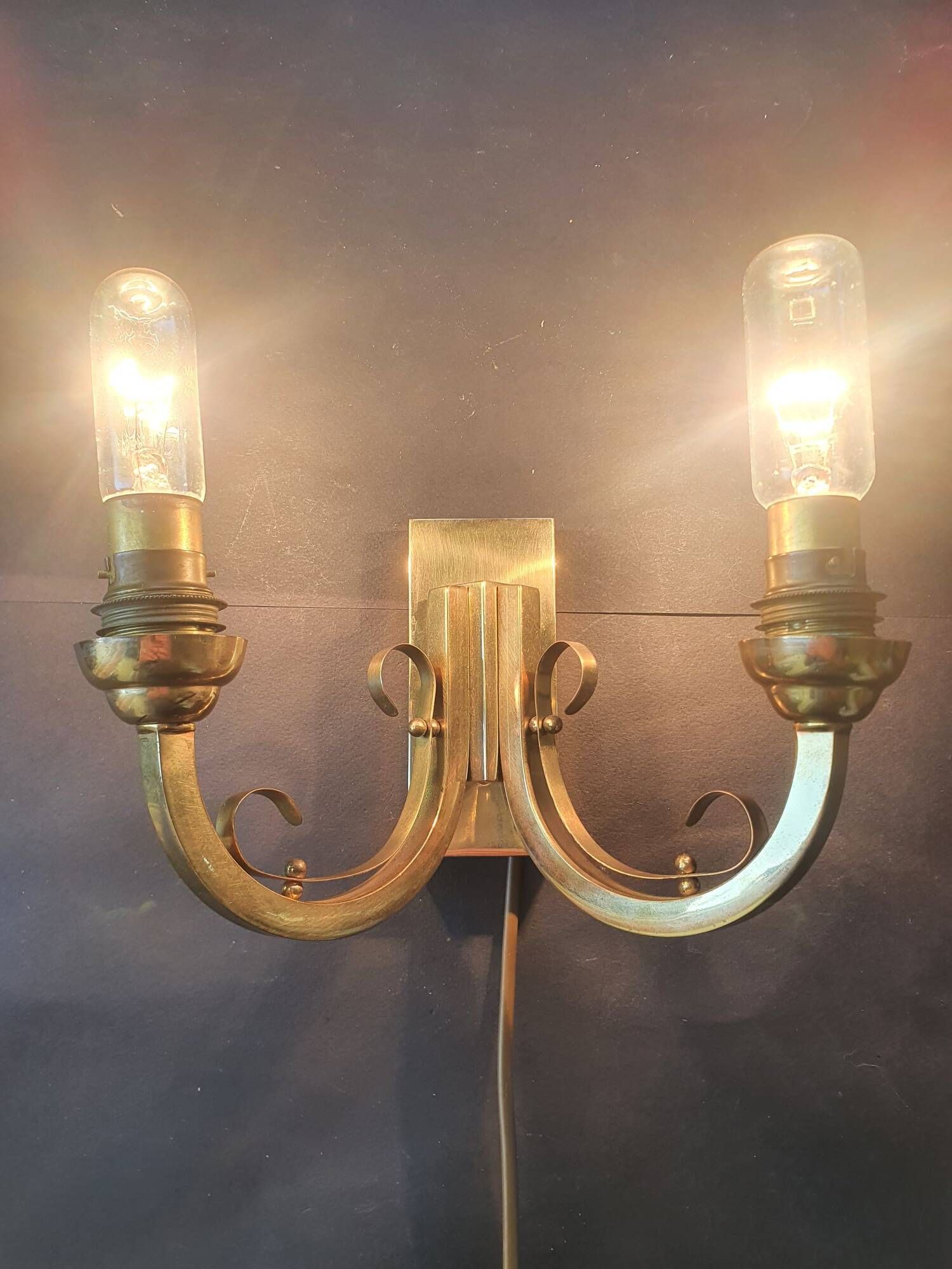 Pair of bronze wall sconces with 1940s Art Deco lampshades.