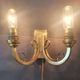 Pair of bronze wall sconces with 1940s Art Deco lampshades.