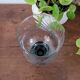 Glass candle holder with black base
