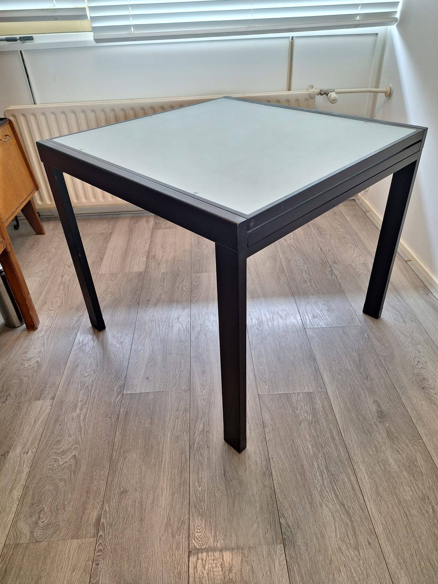 Italian metal table with frosted glass top, extendable.