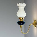 Brass wall sconce with frosted glass tulip lampshade
