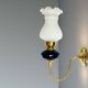 Brass wall sconce with frosted glass tulip lampshade
