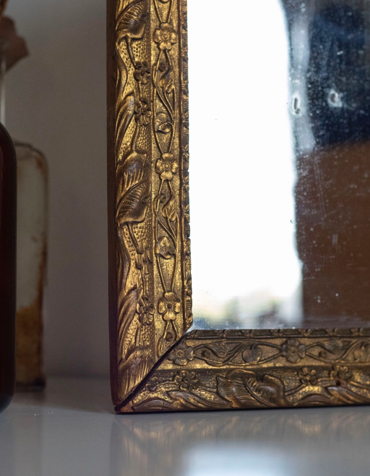 Antique mirror in gilded wood