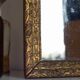 Antique mirror in gilded wood